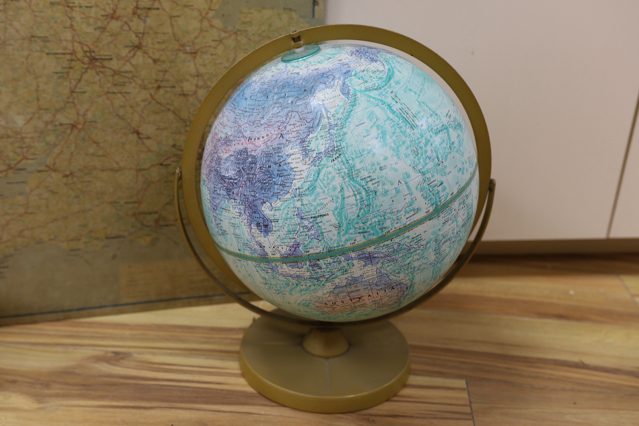 A BP oil can, Michelin motoring map and a revolving globe.